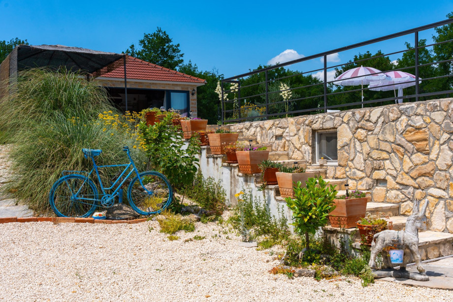 The outdoor area is very spacious and filled with many flower pots and lovely details that the owner carefully set around.