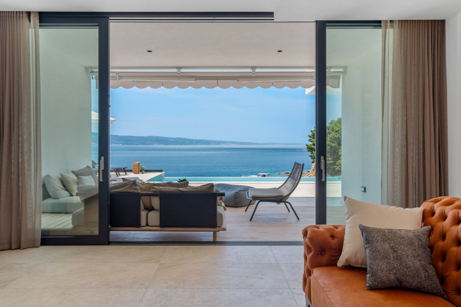 The GROUND floor has an open-plan living area that includes: a fully equipped kitchen (38sqm) with all the amenities a modern guest needs