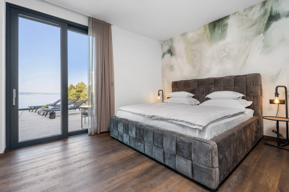 Bedroom No1 (23sqm) is located on the ground floor and has a direct exit toward the pool area