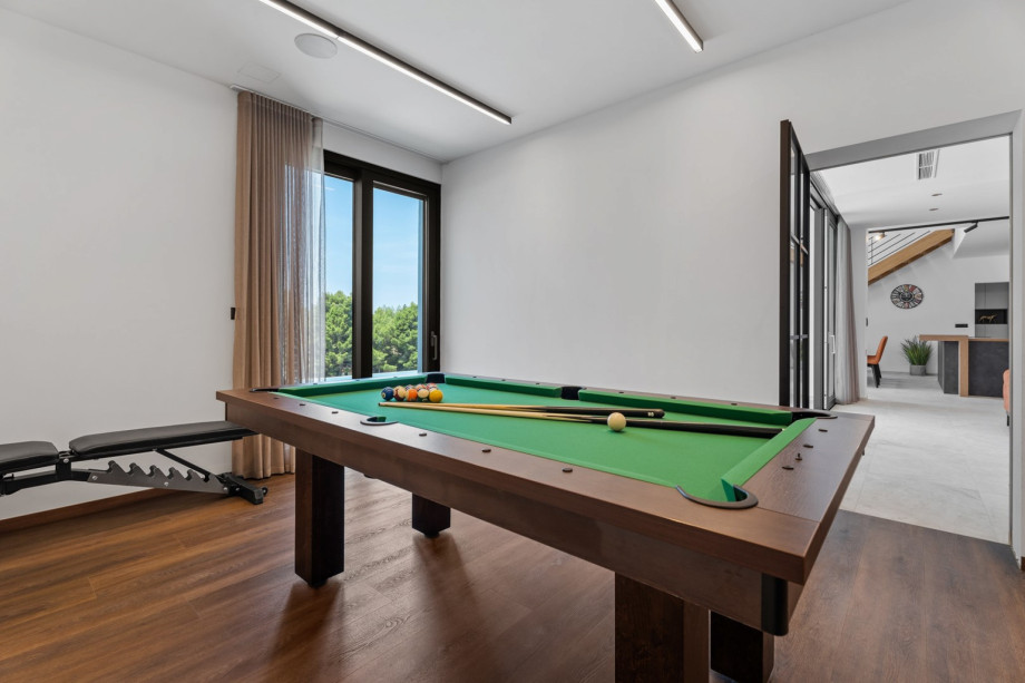 Air-conditioned Gym (22sqm) with a Multipurpose machine, an exercise bike, a Billiard for some fun, a TV, a spacious Finnish sauna, and a shower next to it.