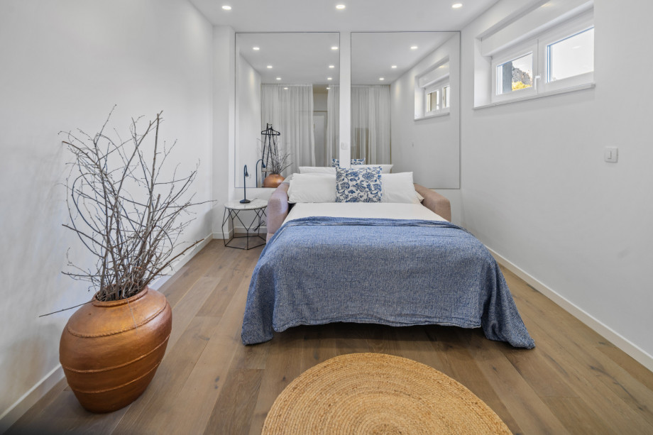 It can be used as a bedroom with a sofa bed and AC