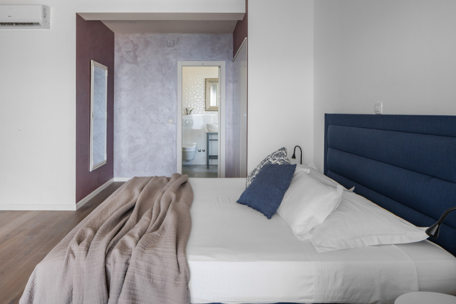 A Bedroom No.3 (29sqm-SW) with king size bed 180*200, en-suite bathroom, A/C, TV, and access to a terrace