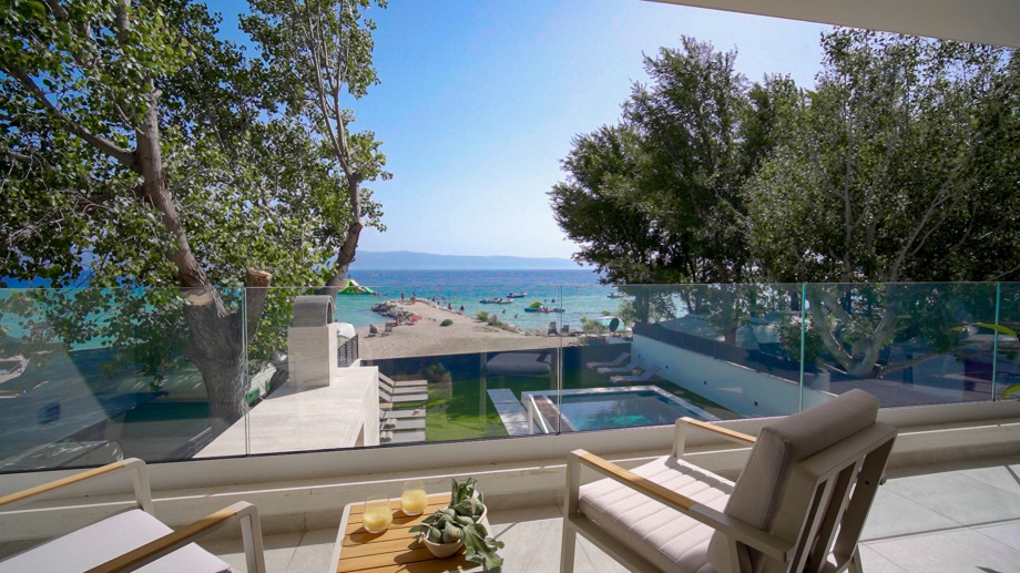 Spacious balcony with breathtaking sea and beach views, exit from Bedrooms No. 1 & 2.