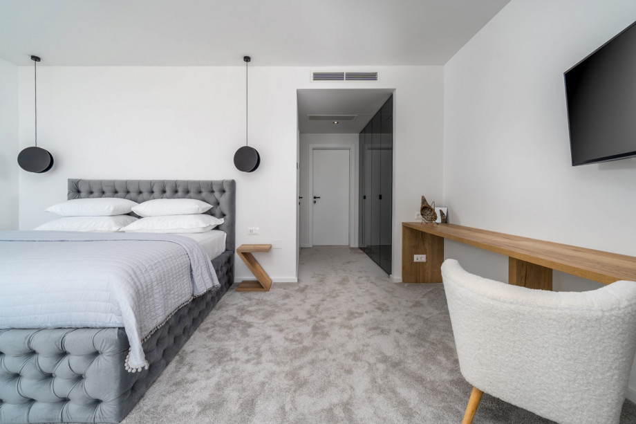 Bedroom No2 (South, 26sqm) offering amazing sea and pool views, with a King size bed 200cm x 200cm, a TV