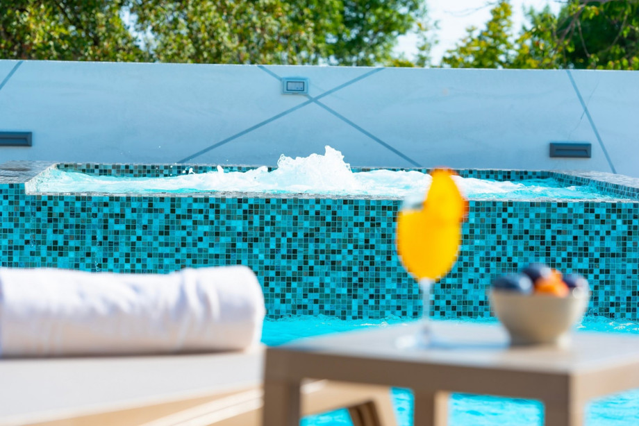 Pool with attached hot tub (whirlpool) with a powerful heater, hydromassage, and a geysir