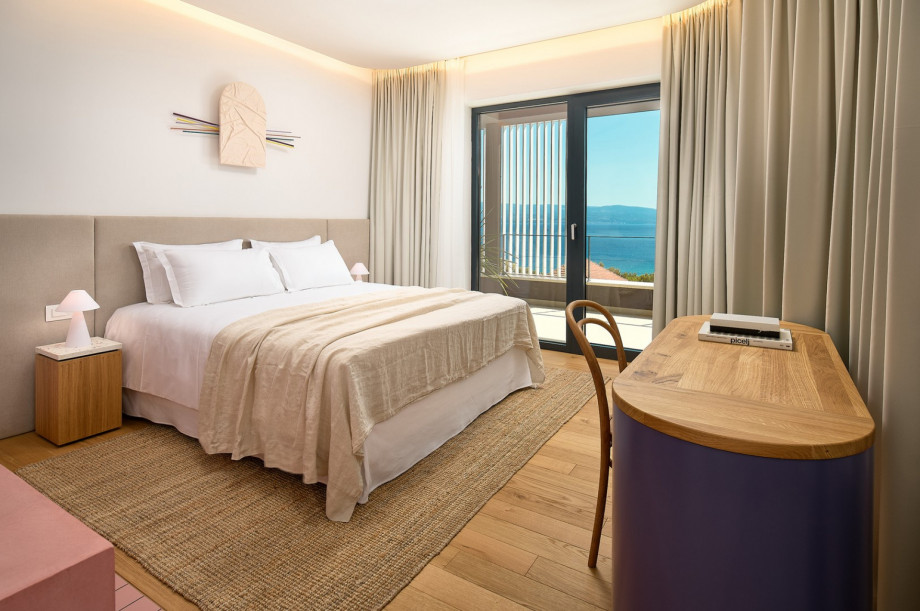 A bedroom also offers an A/C and a balcony