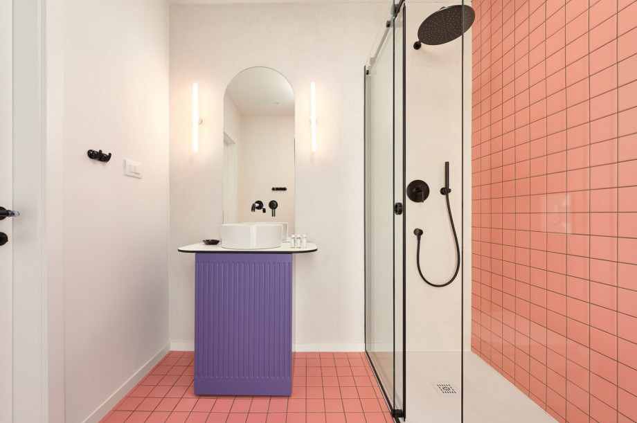 Stylishly decorated bathroom with a shower.