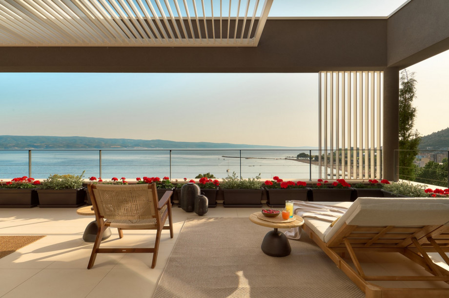 Penthouse is approached from the parking level and offers three master bedrooms