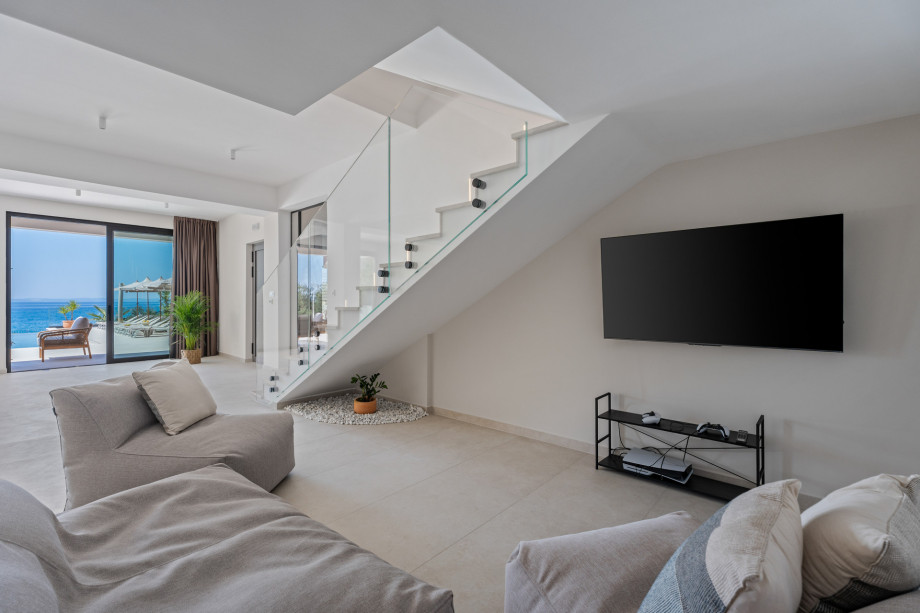 A Fun Zone (15 sqm) furnished with comfy sofas, a TV, and a PlayStation 5 for gaming enthusiasts.