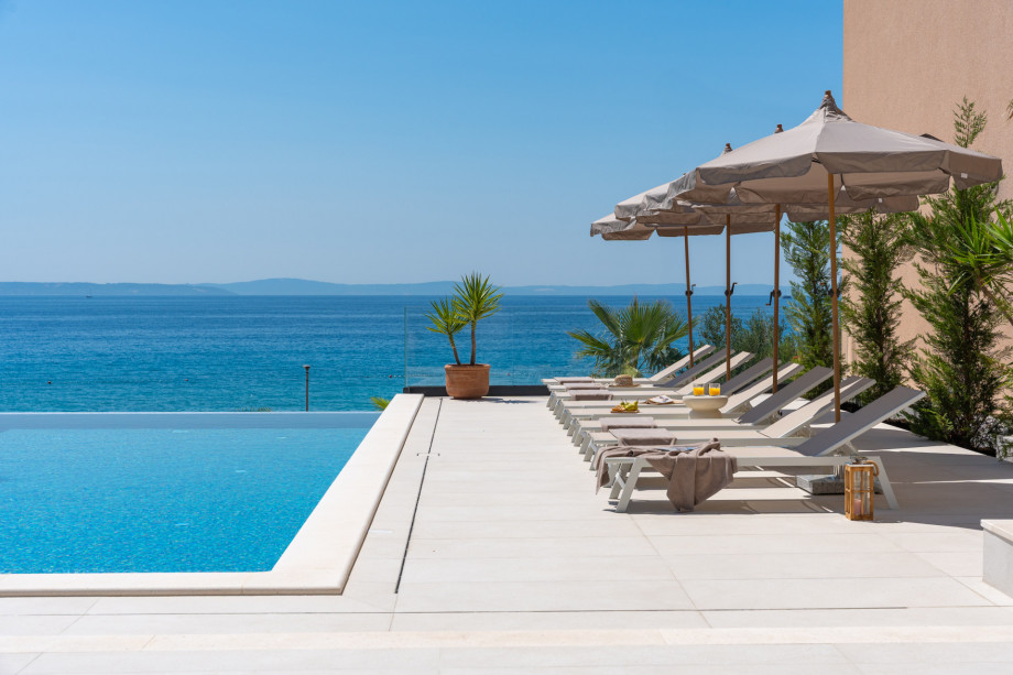 With accommodations for up to 12 guests, this fully air-conditioned villa is perfect for family vacations or gatherings with friends.