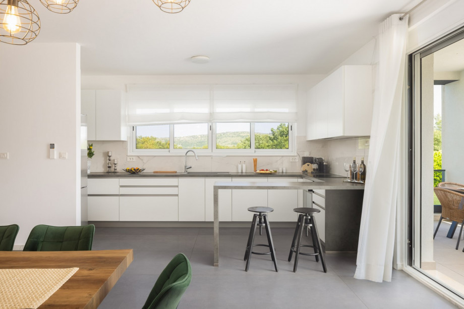 a fully equipped kitchen with a large dining area