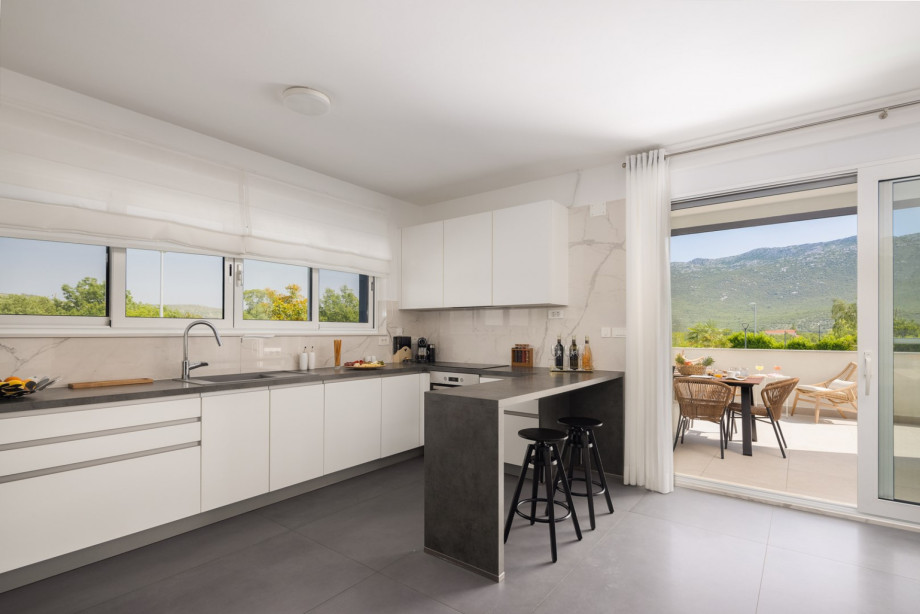 a fully equipped kitchen on the ground floor