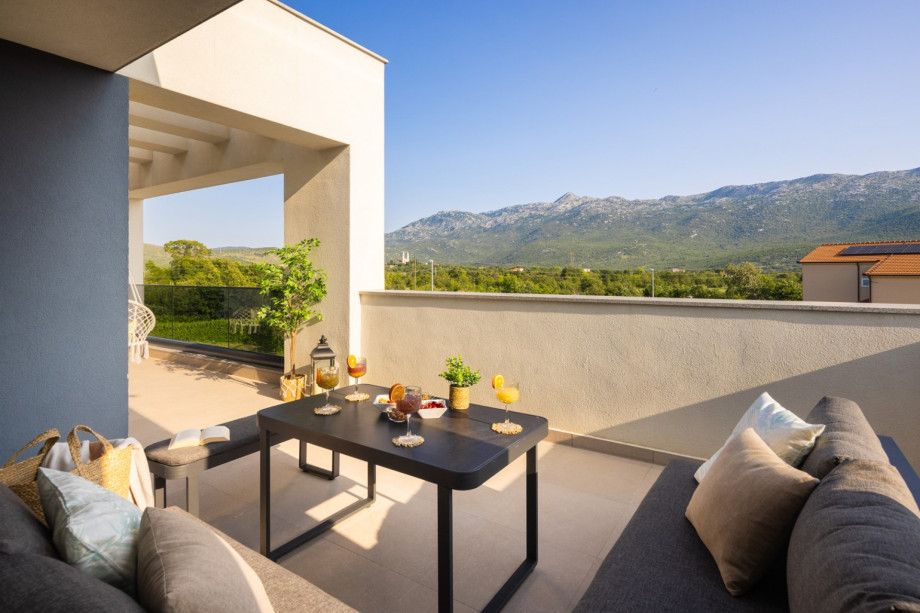terrace and lounge furniture with a pool view