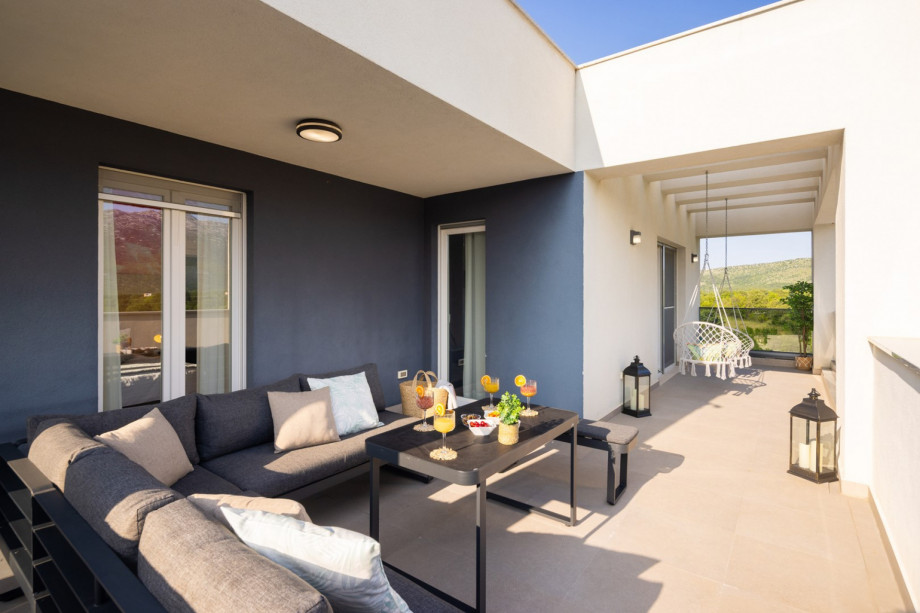 terrace and lounge furniture with a pool view