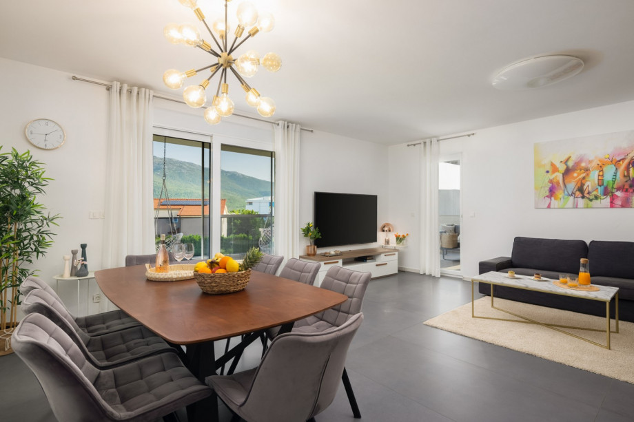 living area with terrace and lounge furniture with a pool view