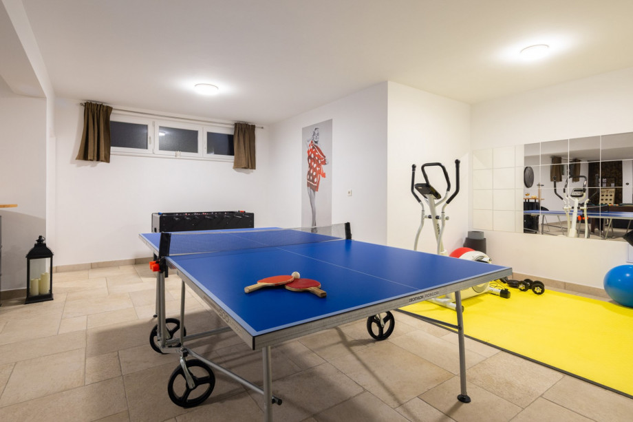 Entertainment area with pool table, darts, table football, table tennis, sofa, PS4 and TV