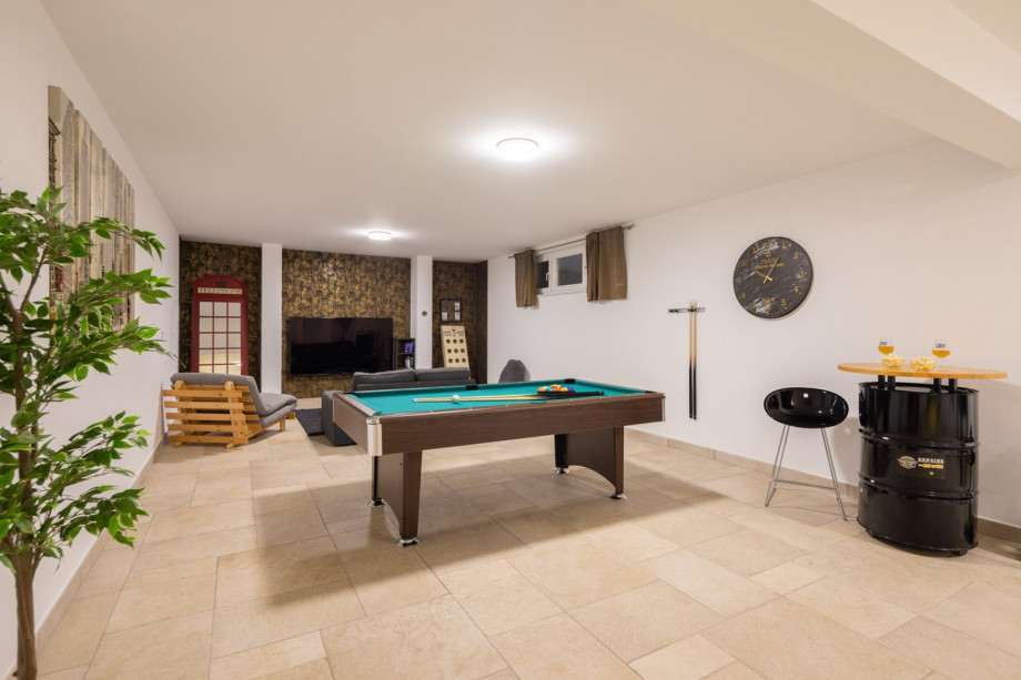 Entertainment area with pool table, darts, table football, table tennis, sofa, PS4 and TV