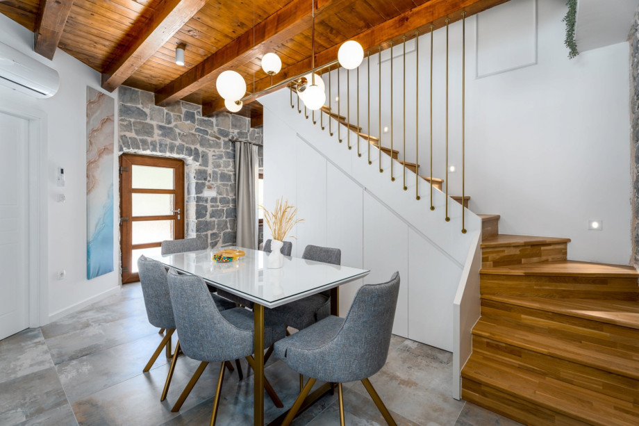 A fully equipped kitchen with a an A/C, and a separate toilet