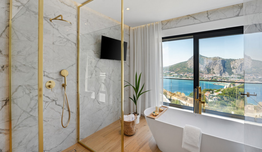 En-suite bathroom with a shower and a bathtub