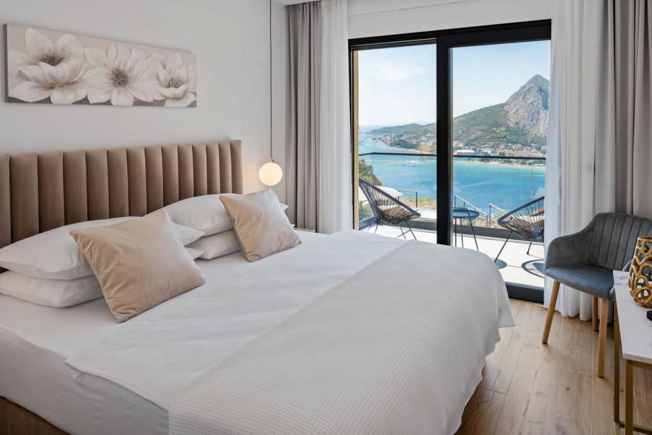 Bedroom NO4 with a king size bed measuring 180cm x 200cm, en-suite bathroom with a shower, a TV,  air conditioning and a balcony