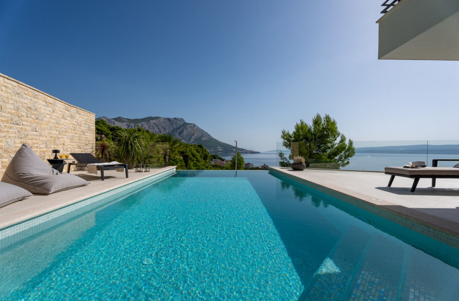 The pool area can be directly approached from the Kitchen and the Media room.