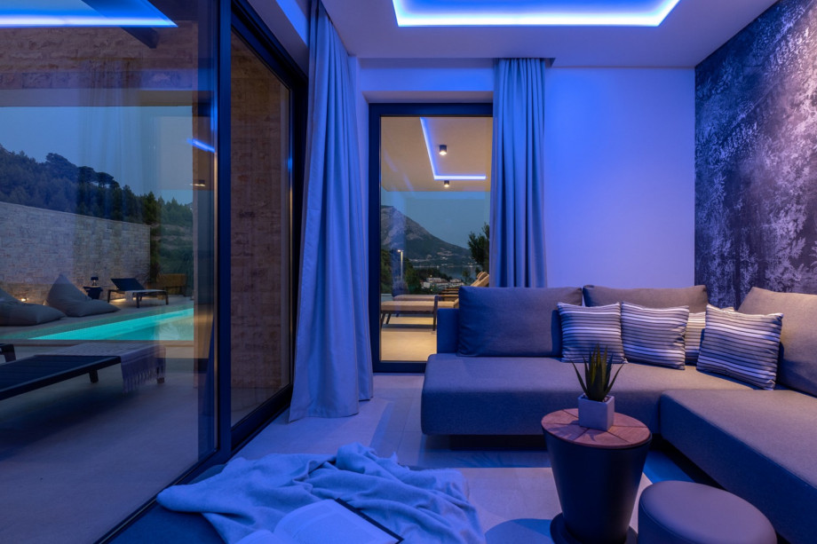 There is a Media room with a flat-screen TV, PS5, Bose sound bar, air conditioner