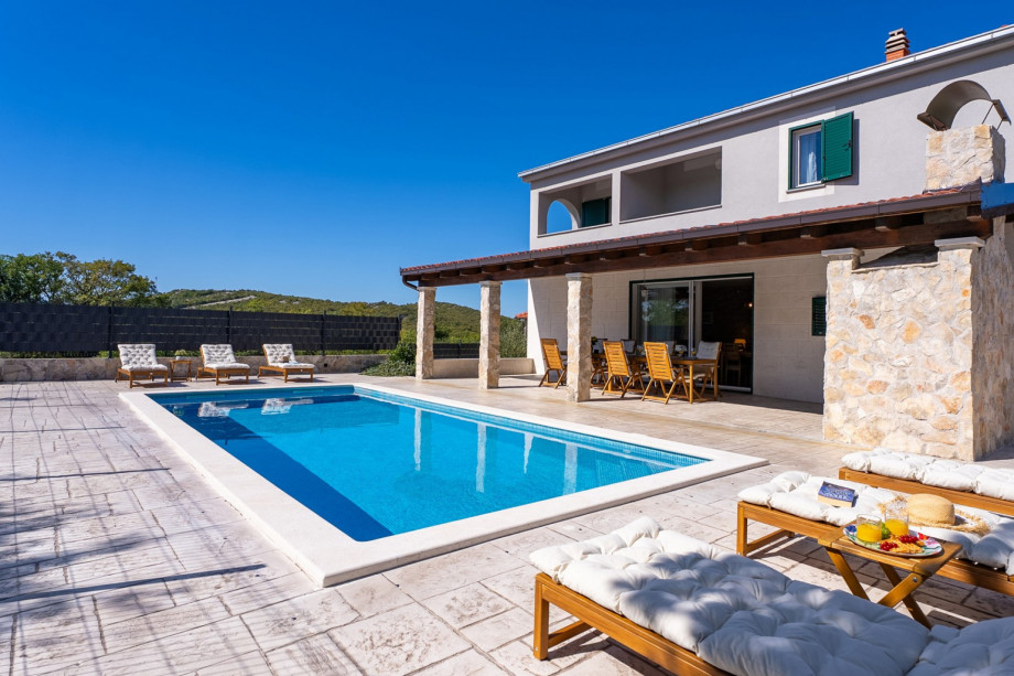It features a generous 36sqm heated swimming pool—perfect for cooling off or soaking up the sun on warm days.