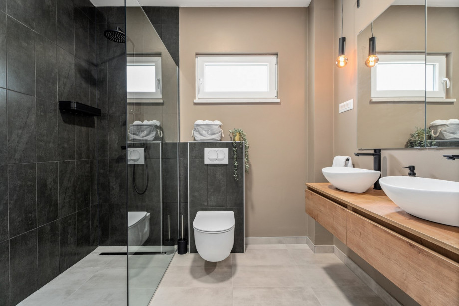 Family bathroom 5,7 sqm with a shower, shared for Bedroom NO3 and NO4.