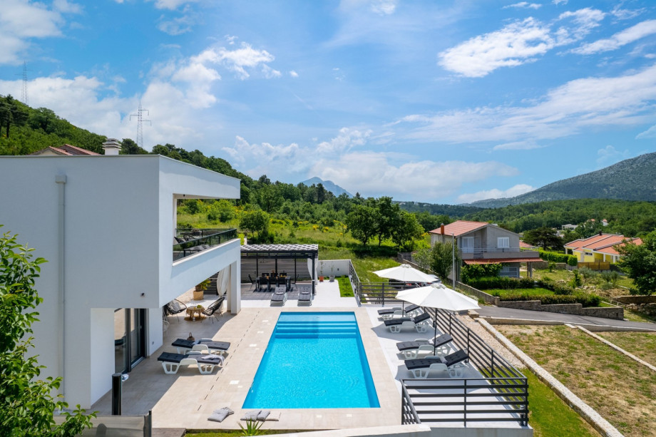 The pool area overlooks the village center and an outdoor playground for kids.