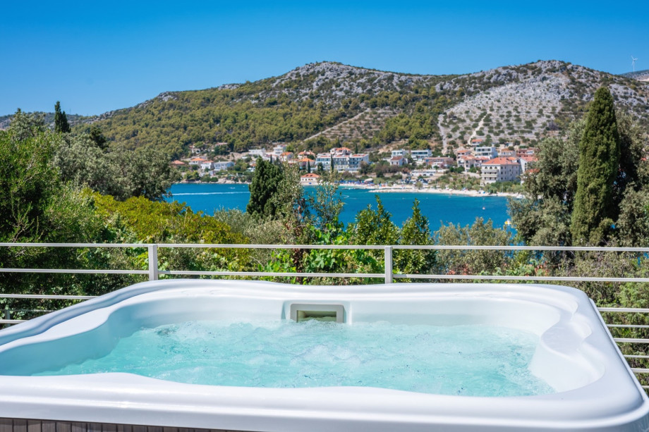 Relax in the jacuzzi just a hundred meters from the crystal clear sea