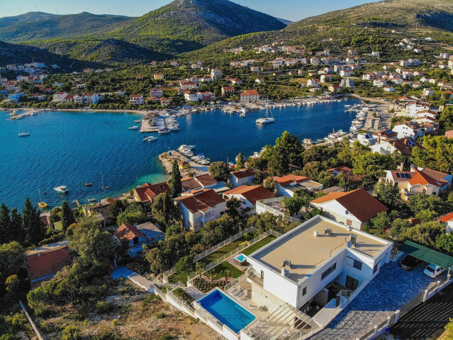 Experience the epitome of luxury living at Villa Paloma Blanca, where every detail is meticulously crafted