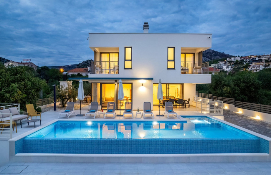 Pool area with carefully set lights for cozy evenings in quiet area