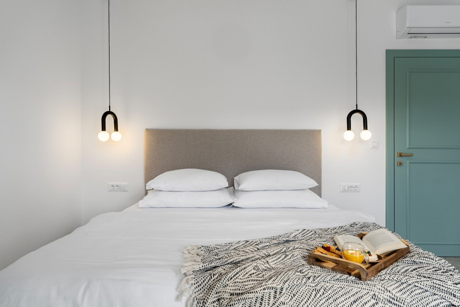 Bedroom No.1 also offers an en-suite bathroom with a refreshing shower, a TV, A/C, and a private balcony