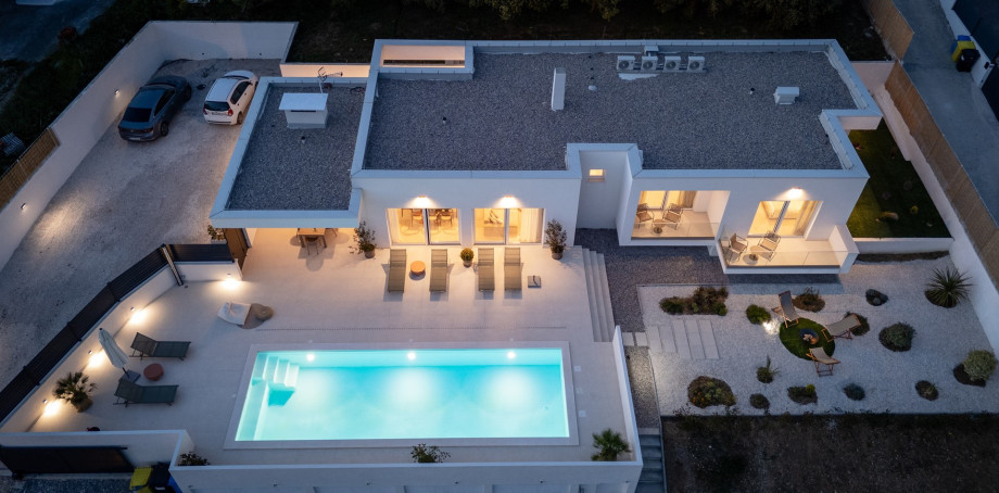 The villa is nestled on a spacious 1,940 sqm private plot, boasting a generous 162 sqm interior