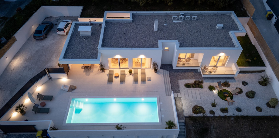 The villa is nestled on a spacious 1,940 sqm private plot, boasting a generous 162 sqm interior