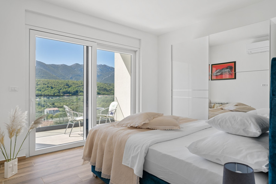 Bedroom No. 2 features a 160cm x 200cm queen-size bed, air conditioning, en-suite shower bathroom, a shared terrace