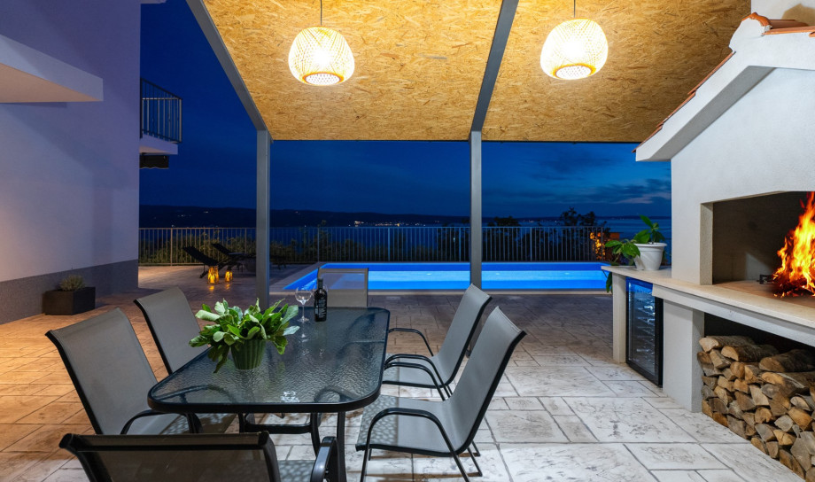 Outdoor dining area with barbecue is the best place for a family gathering