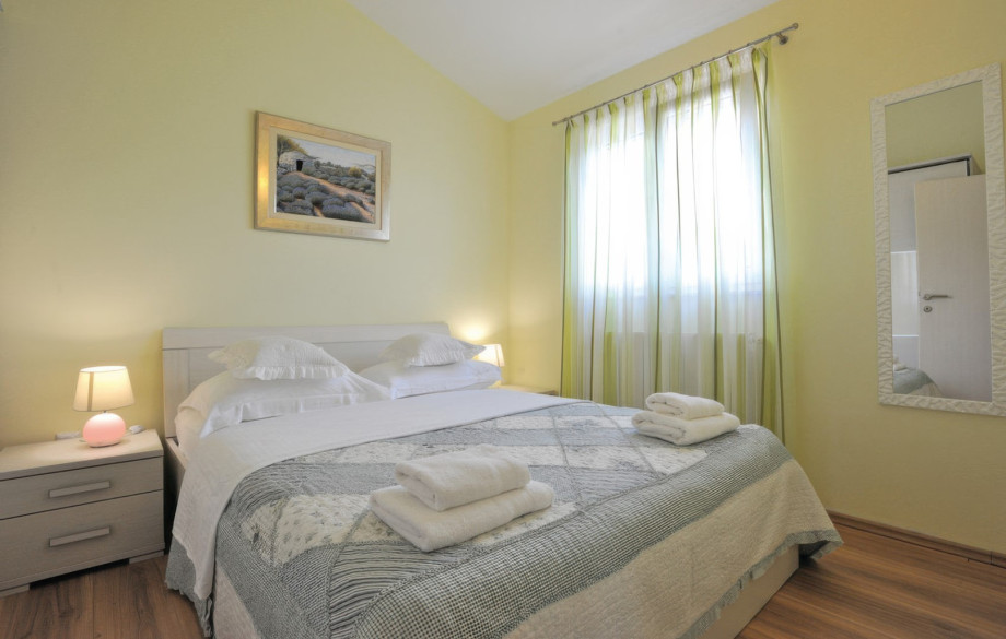 One of the six air-conditioned bedrooms offers a comfortable queen or king-size bed with soft linens, ensuring a peaceful night's rest.