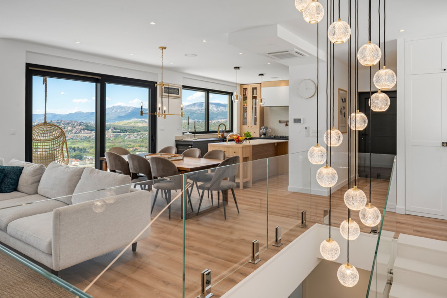 The first floor (parking level) offers a contemporary open concept kitchen and living room