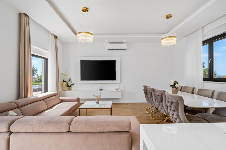 Living room and dinning area with exit to pool area, all is air - condition