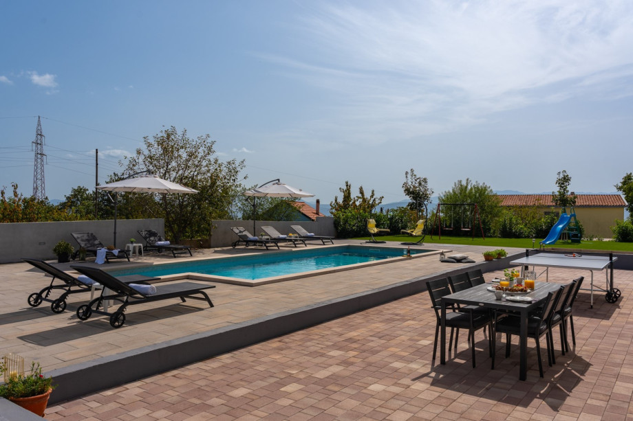 Children's playground with swing and slide