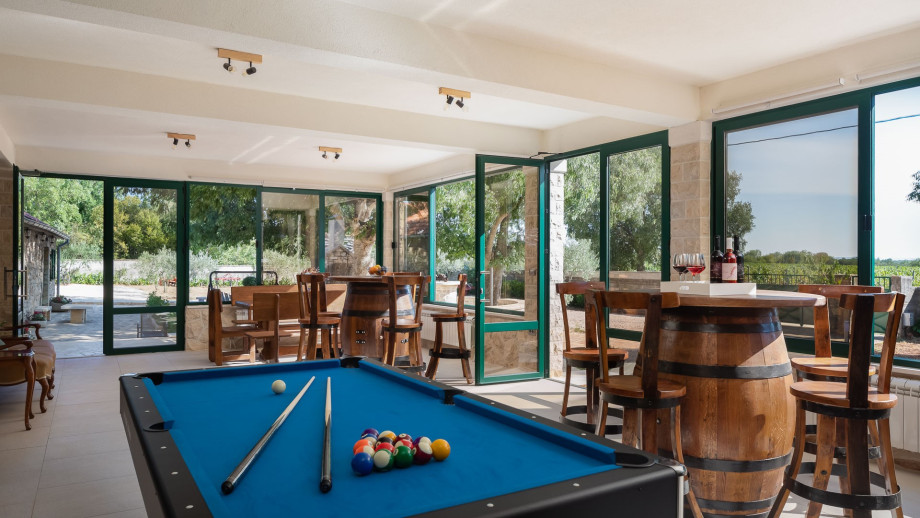 Spacious, glazed terrace with Billiards, Darts, a wooden dining table and two handmade wooden bar tables