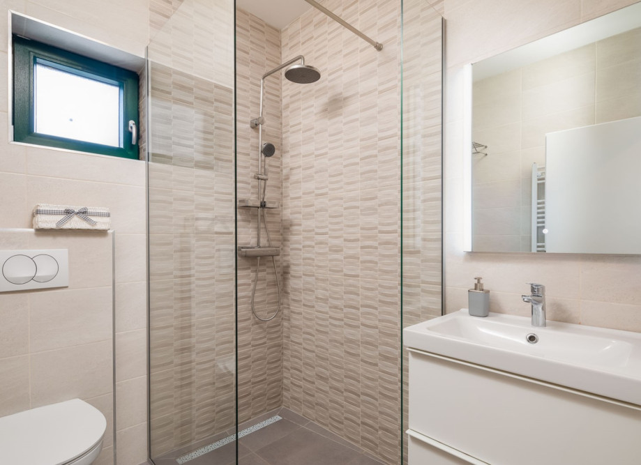 A Family Bathroom NO5 with a shower, towels are provided