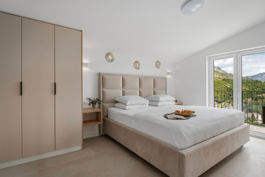 Bedroom NO6 (16sqm) with a super king size bed 200cm x 200cm, TV,A/C, a balcony with sea views