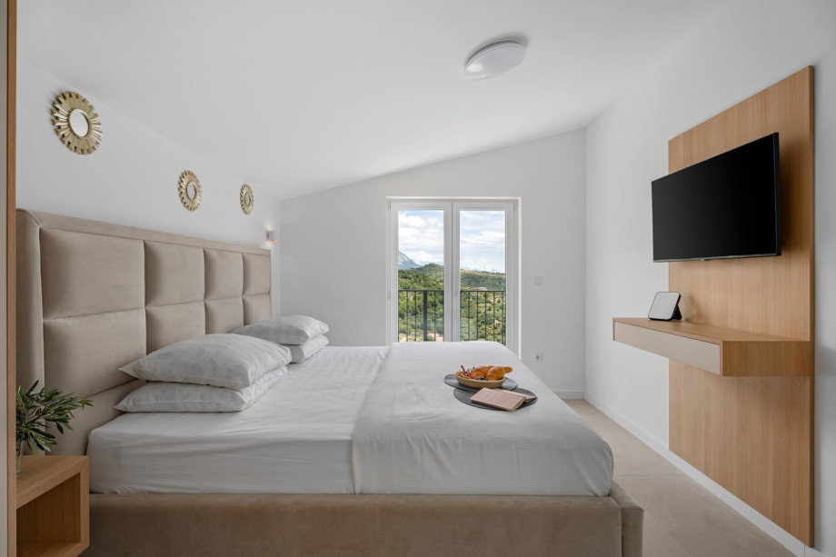 Bedroom NO6 (16sqm) with a super king size bed 200cm x 200cm, TV,A/C, a balcony with sea views