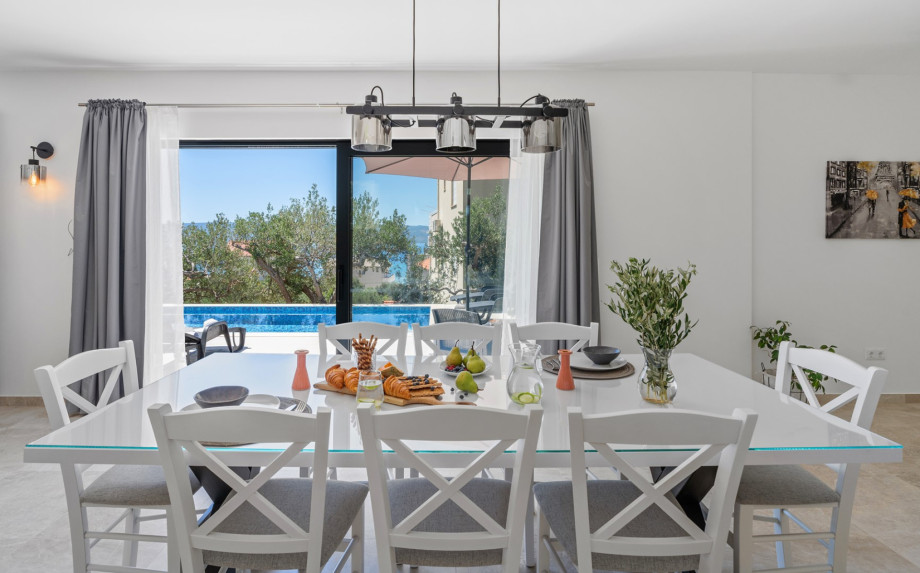 Living room, dining area, and kitchen are all connected by an open-plan layout