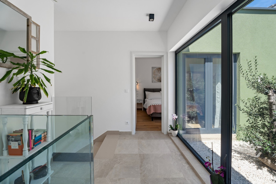 Hallway that connects all of the rooms with the living area