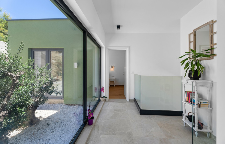 Hallway that connects all of the rooms with the living area