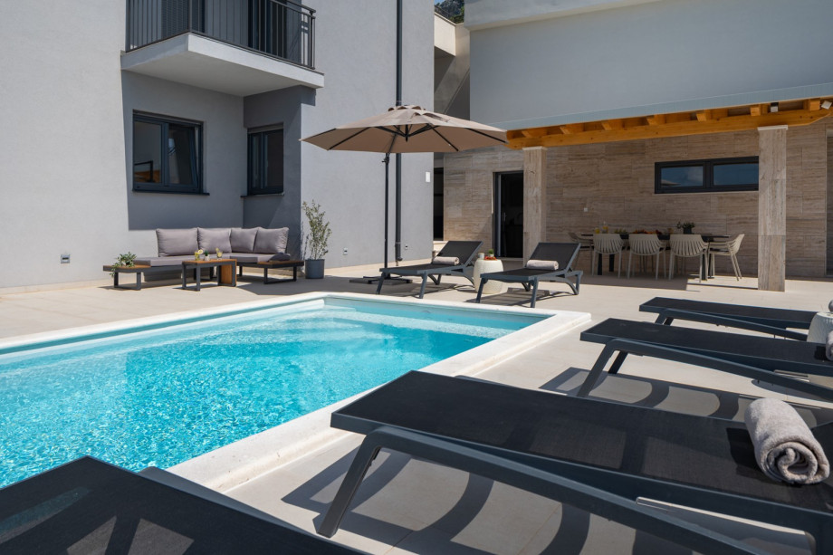 Sundeck area with private heated pool