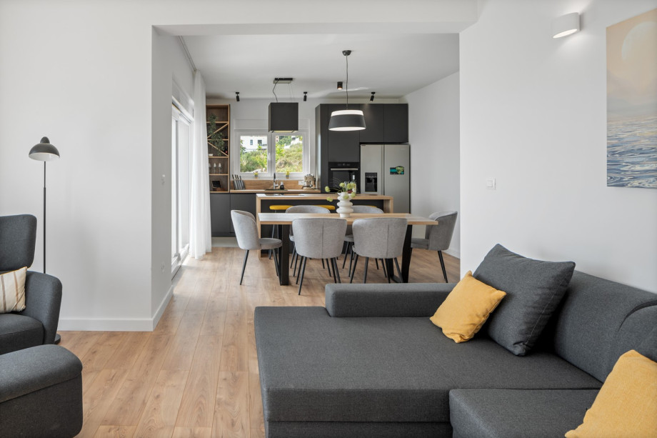 Living room, dining area, and kitchen are all connected by an open-plan layout